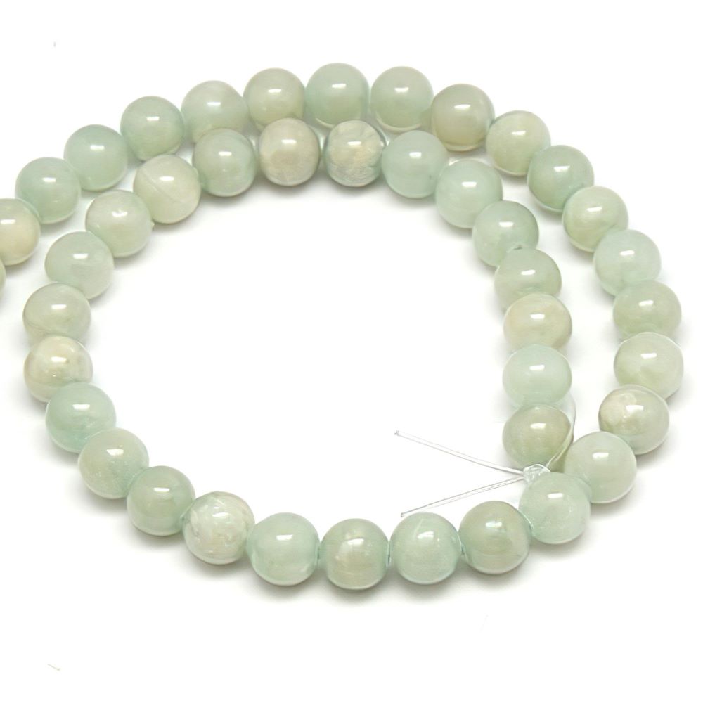 A strand of 61+ bowenite beads, pale green in colour, 6mm in size, round shaped