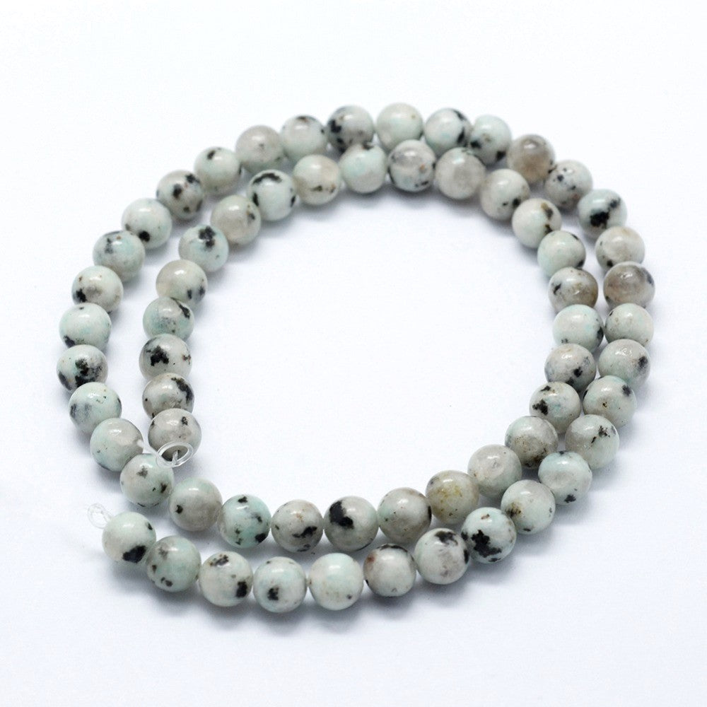 A strand of 46+ sesame jasper beads, blue and grey in colour, 8mm in size, round shaped
