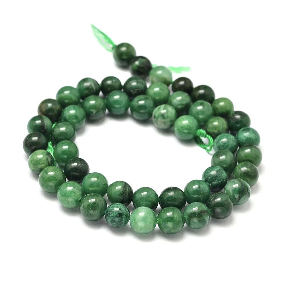 A strand of 40+ african jade beads, green in colour, 8mm in size, round shaped