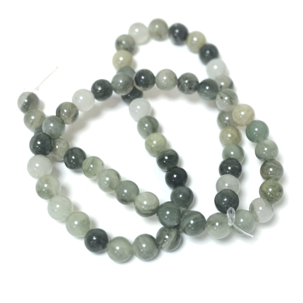 A strand of 60+ line quartz beads, green in colour, 6mm in size, round shaped
