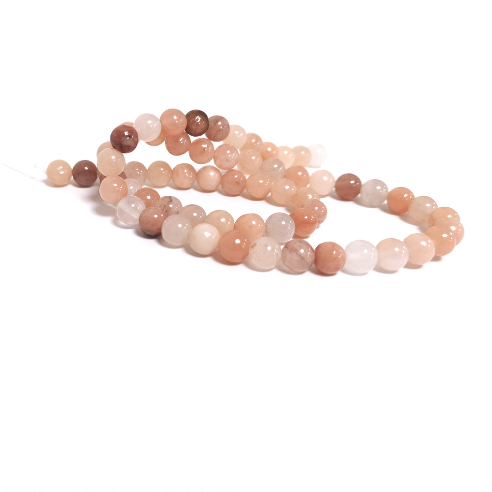 A strand of 57+ aventurine beads, peach in colour, 6mm in size, round shaped