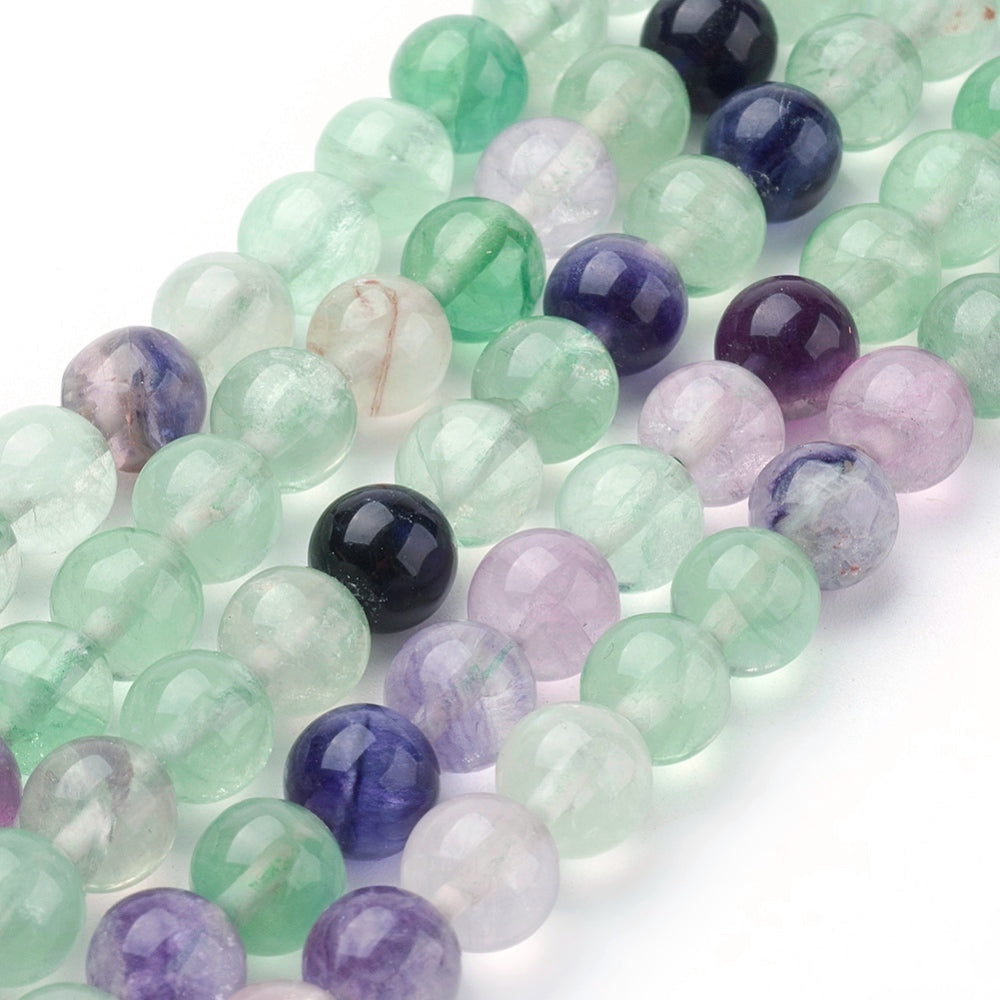 A strand of 60+ rainbow fluorite beads, green and purple in colour, 6mm in size, round shaped