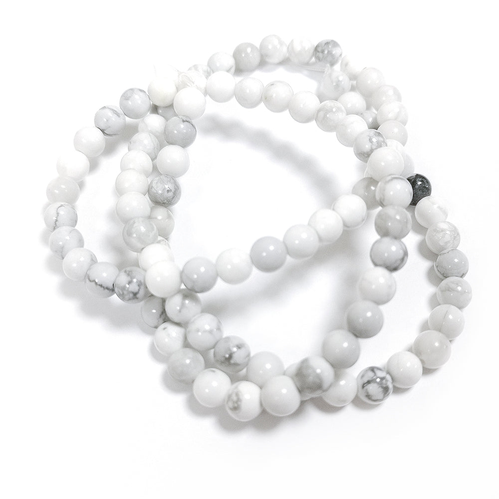 A strand of 78+ howlite beads, white and grey in colour, 4mm in size, round shaped