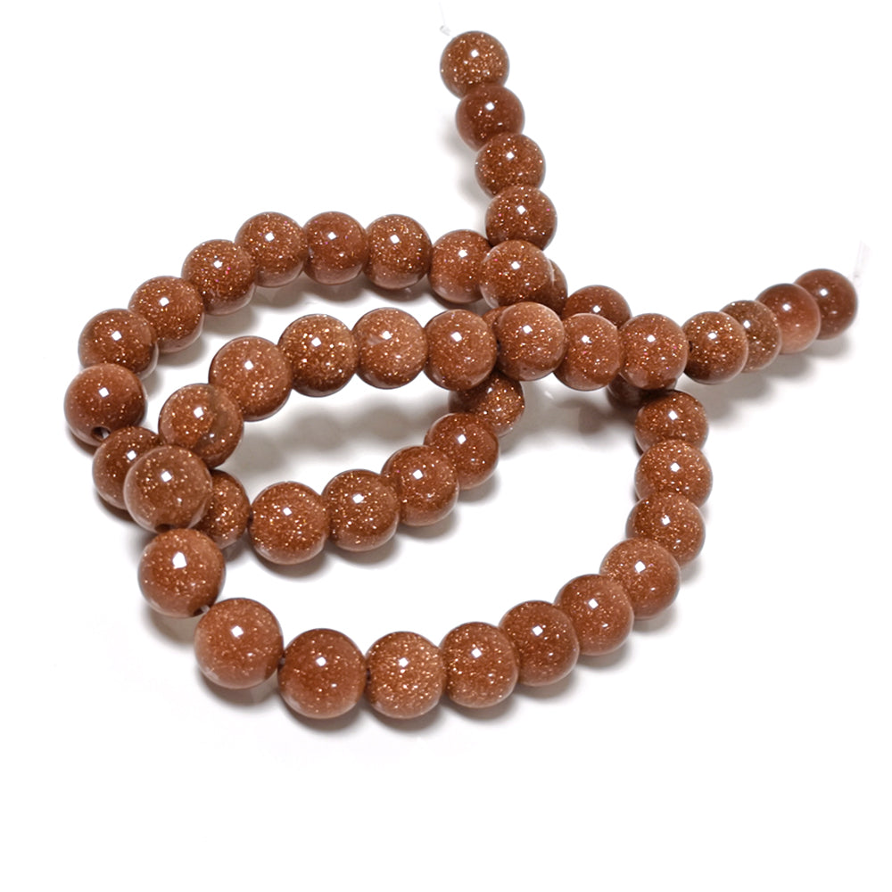 A strand of 45+ goldstone beads, brown in colour, 8mm in size, round shaped