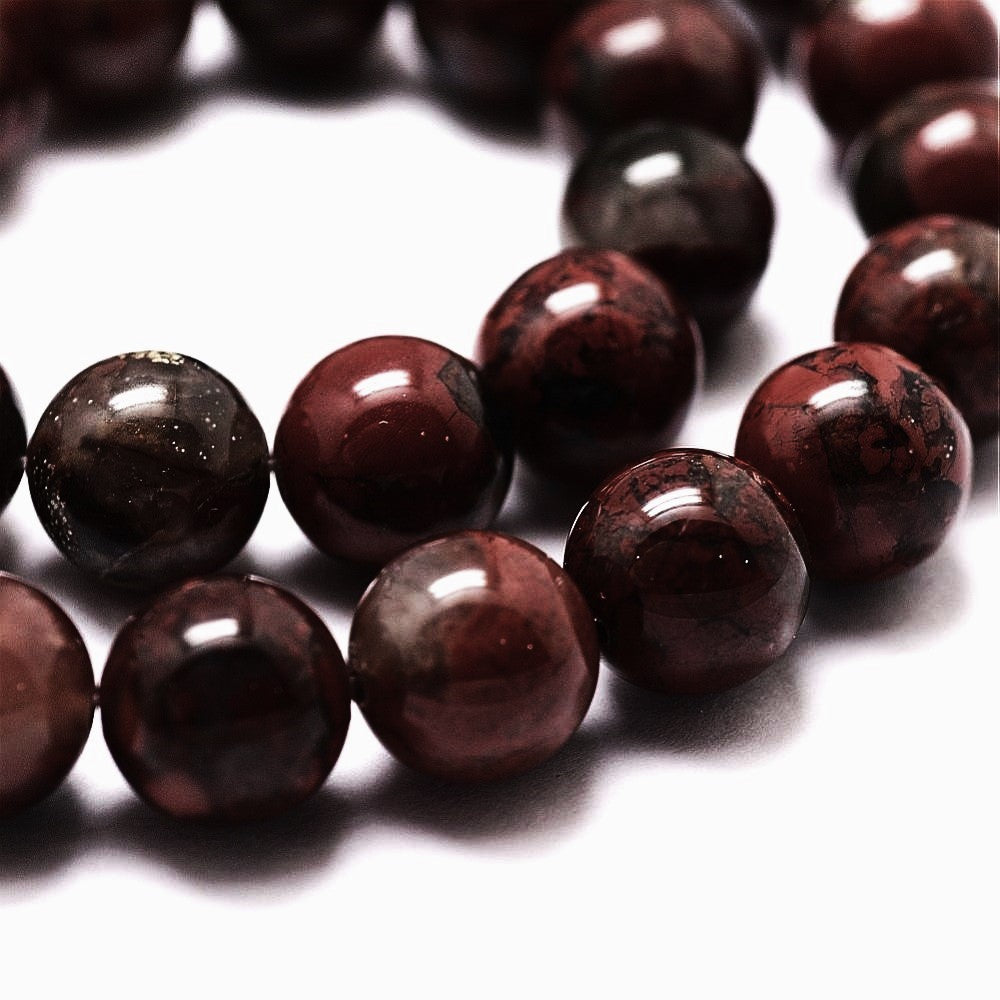 A strand of 60+ Poppy Jasper beads, red in colour, 6mm in size, round shaped