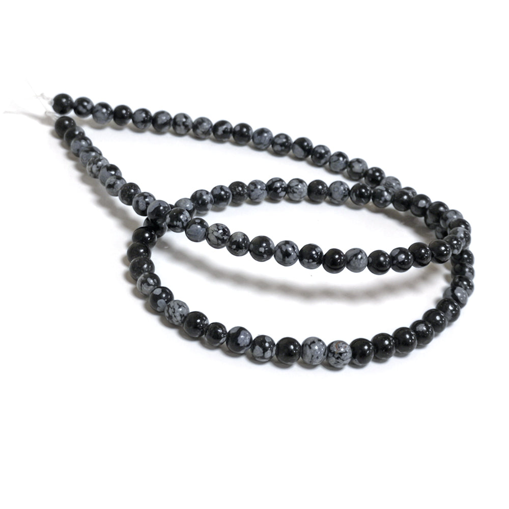 A strand of 82+ snowflake obsidian beads, black and grey in colour, 4mm in size, round shaped