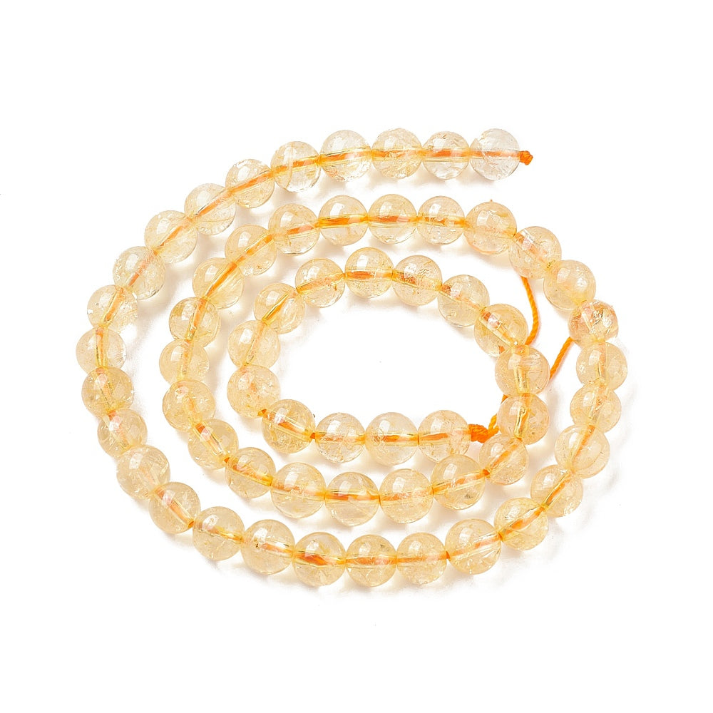 A strand of 45+ citrine beads, golden coloured, 8mm in size, round shaped