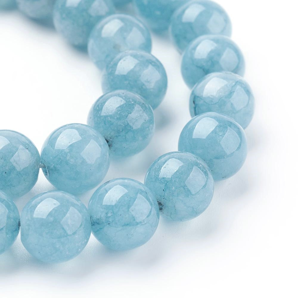 A strand of 45+ sponge quartz beads, blue in colour, 8mm in size, round shaped