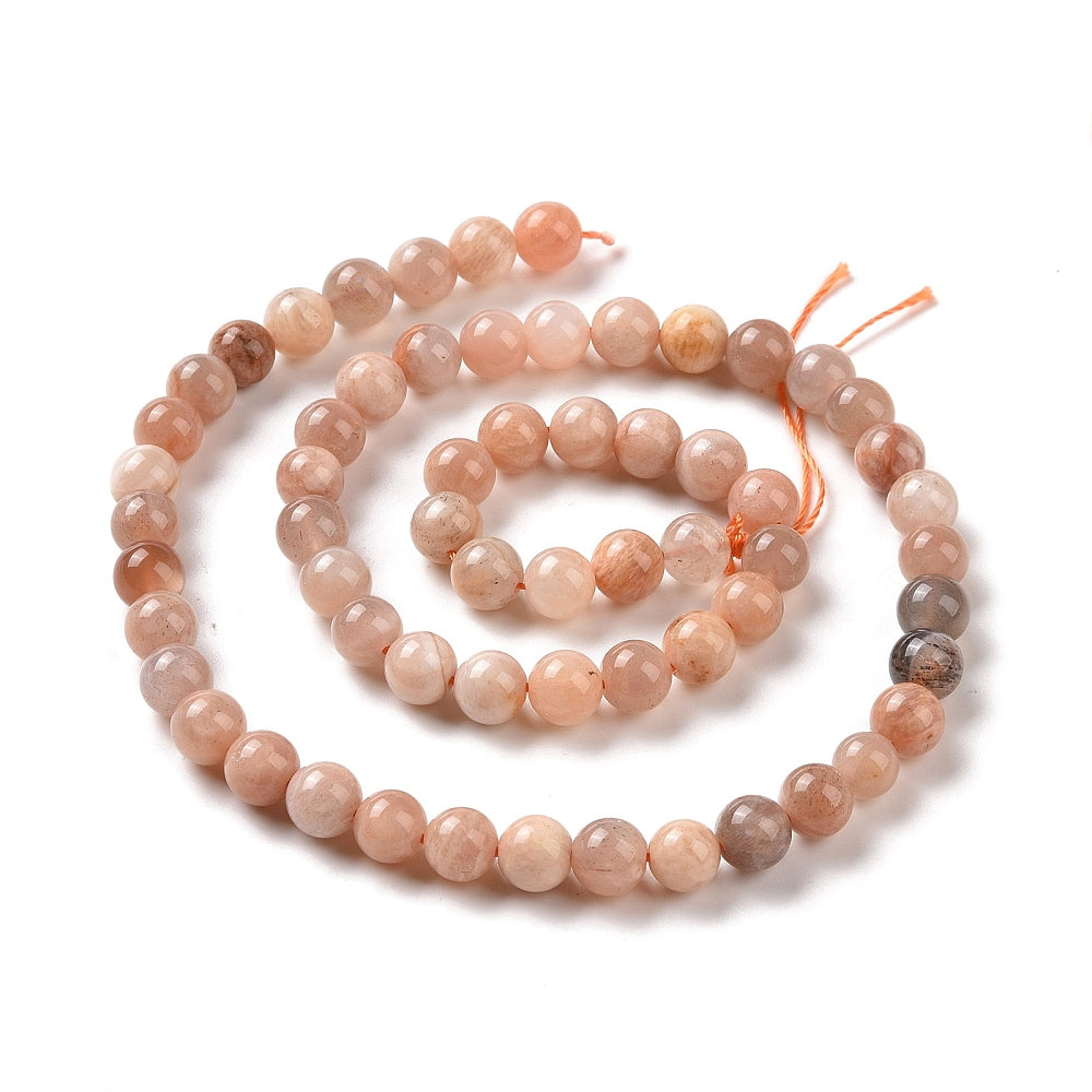A strand of 62+ sunstone beads, peachy pink, 6mm in size, round shaped