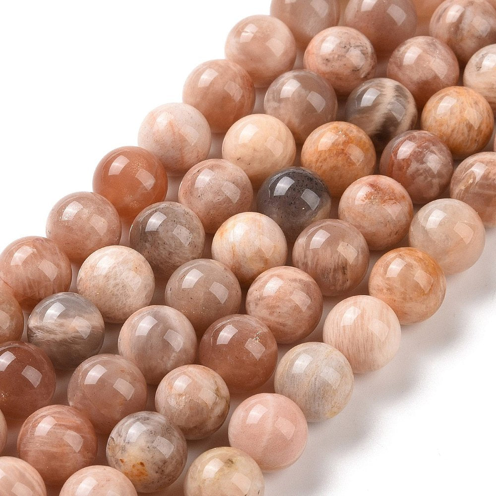 A strand of 47+ sunstone beads, peachy pink, 8mm in size, round shaped