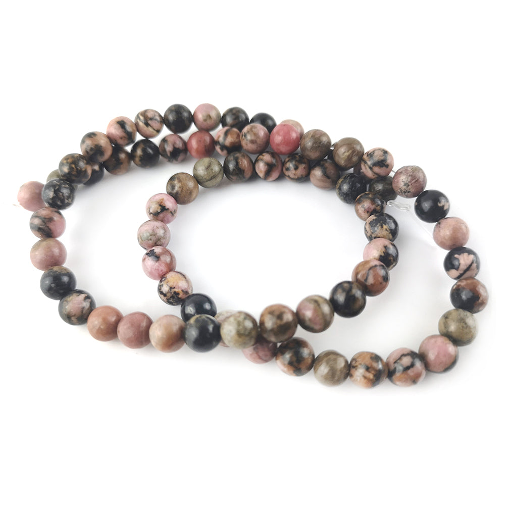 A strand of 60+ rhodonite beads, pink and black in colour, 6mm in size, round shaped