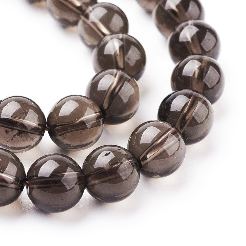 A strand of 20+ smoky quartz beads, brown in colour, 8mm in size, round shaped