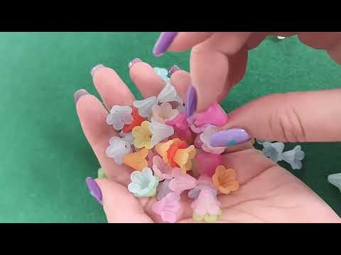 A pack of 70+ lucite beads, mixed-colours, 10x15mm in size, Flower shaped