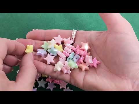 A pack of 100+ acrylic beads, mixed pastel colours, 14x13mm in size, star shaped, AB iridescent finish