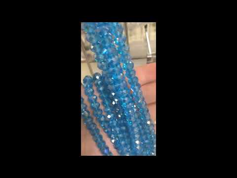 A strand of 65+ Czech Crystal beads, Cyan in colour, 6x8mm in size, rondelle shaped, faceted