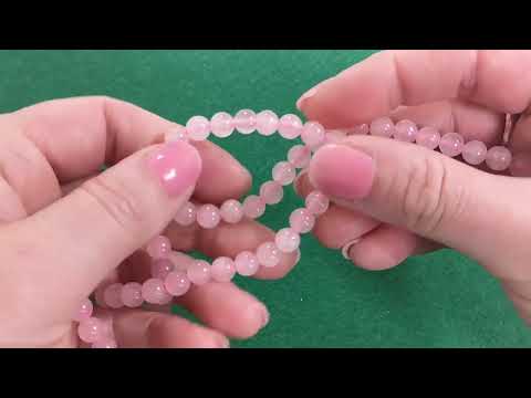 A strand of 60+ rose quartz beads, pink in colour, 6mm in size, round shaped