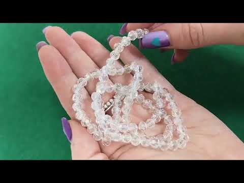 A strand of 80+ czech crystal beads, clear in colour, 6mm in size, round shaped and faceted with an AB finish