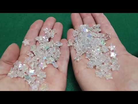 A pack of 100+ Acrylic beads, clear in colour, 10mm in size, star shaped, AB finish