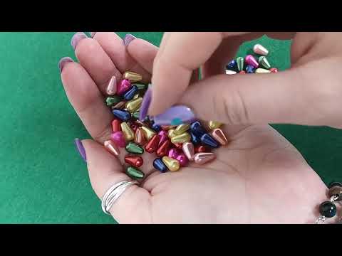 A pack of 100+ Acrylic beads, mixed colours, 6x10mm in size, drop shaped