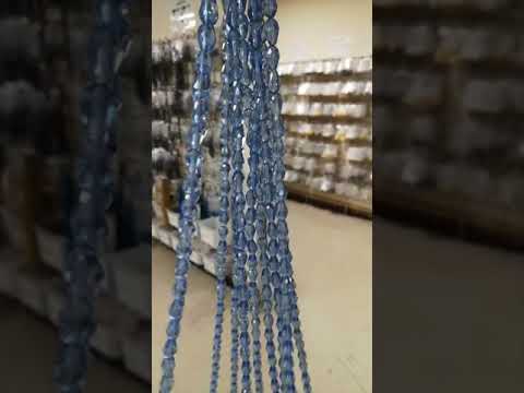 A strand of 45+ czech crystal beads, blue in colour, 10x15mm in size, drop shaped, faceted