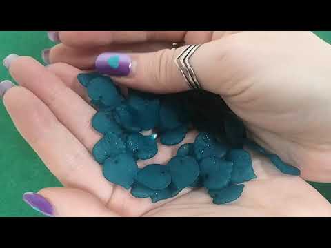 A pack of 50 lucite beads, teal blue in colour, 15x16mm in size, leaf shaped