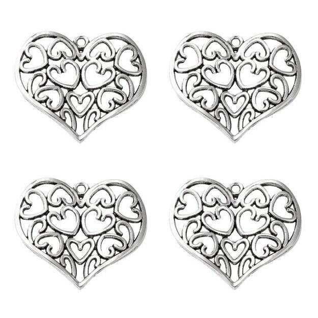 A pack of 4 metal alloy pendants, antique silver coloured, 37mm in size, heart shaped