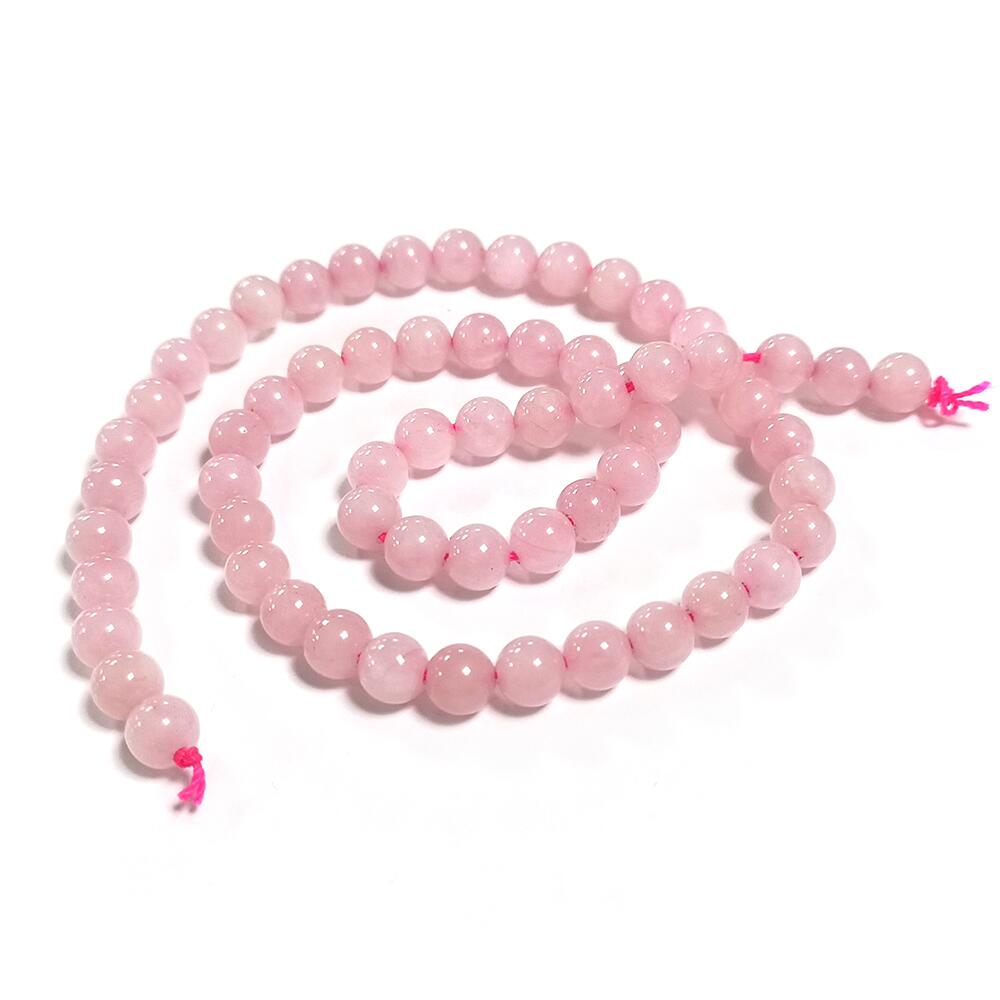 A strand of 60+ rose quartz beads, pink in colour, 6mm in size, round shaped