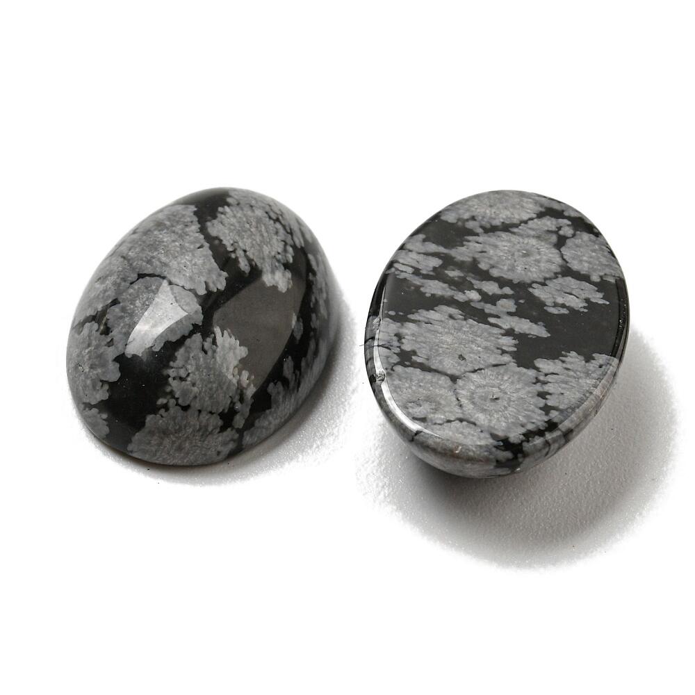 A pack of 2 snowflake obsidian cabochons, black in colour, 13x18mm in size, oval shaped, flat backed, calibrated