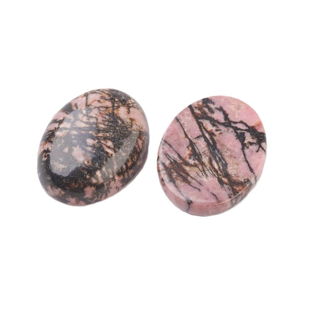 A rhodonite cabochon, pink in colour, 18x25mm in size, oval shaped, flat backed, calibrated