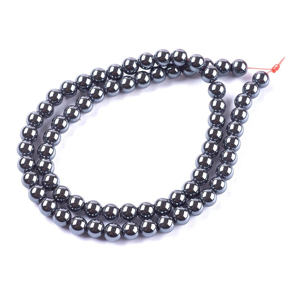 A strand of 60+ hematite beads, grey in colour, 6mm in size, round shaped, non magnetic