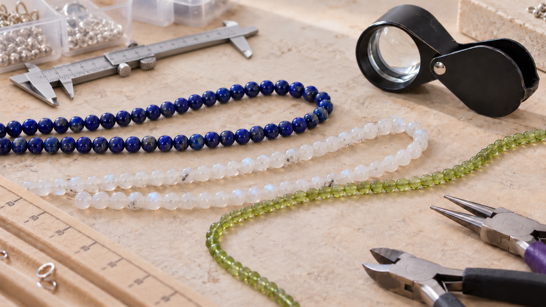 Natural gemstone bead strands arranged for a guide to identifying genuine gemstone beads