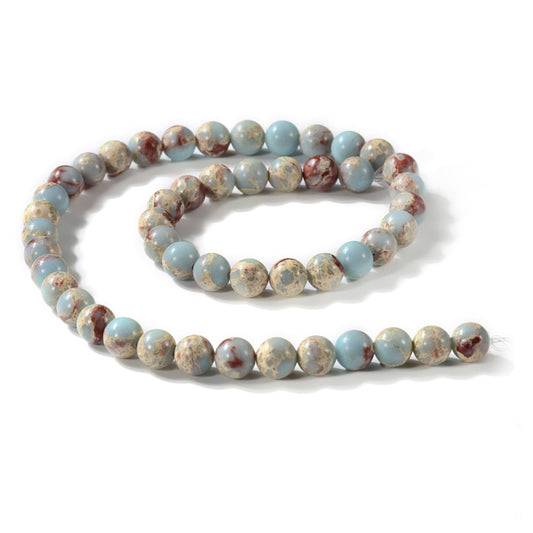 A strand of 46+ Aqua Terra Jasper beads, pale blue and red in colour, 8mm in size, round shaped