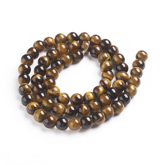 A strand of 62+ tiger eye beads, yellow and brown in colour, 6mm in size, round shaped