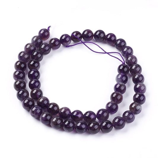 A strand of 45+ amethyst beads, purple in colour, 8mm in size, round shaped