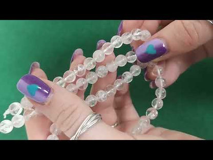 A strand of 58+ Rock Crystal beads, clear in colour, 6mm in size, round shaped