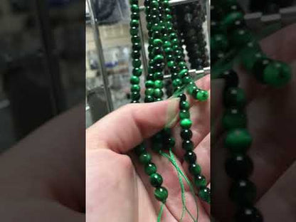 A strand of 60+ tiger eye beads, green and black in colour, 6mm in size, round shaped