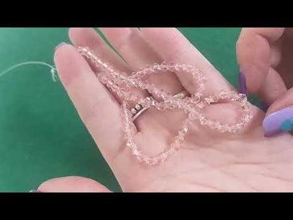 A strand of 90+ czech crystal beads, pink in colour, 4mm in size, bicones, faceted