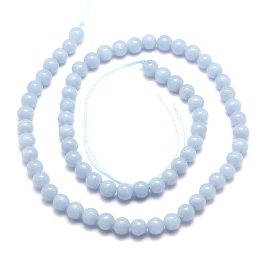 A strand of 60+ angelite beads, blue in colour, 6mm in size, round shaped