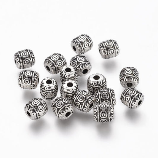 A packet of 50 brass spacer beads, silver in colour, 8mm in size, round shaped, stardust finish