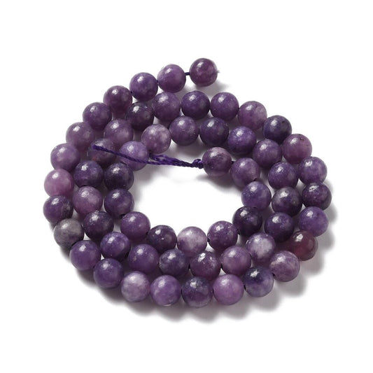 A strand of 60+ lepidolite beads, purple in colour, 6mm in size, round shaped