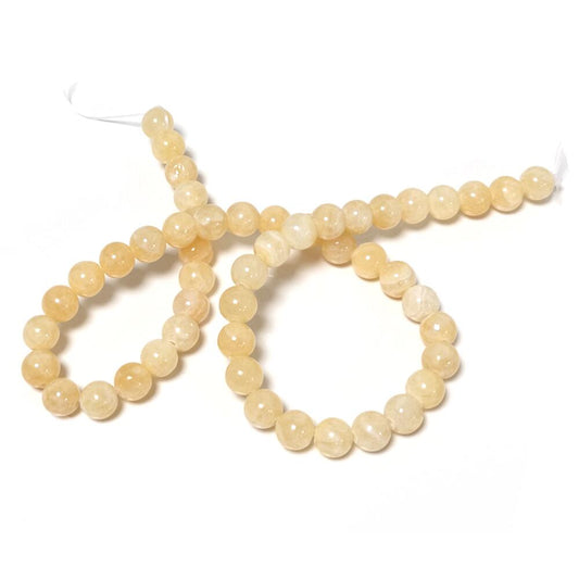 A strand of 46+ honey jade beads, yellow in colour, 8mm in size, round shaped
