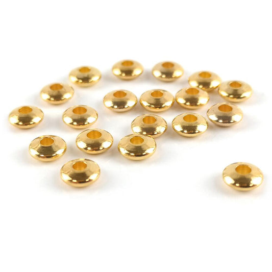 A packet of 20 brass spacer beads, gold in colour, 2x5mm in size, Rondelle shaped