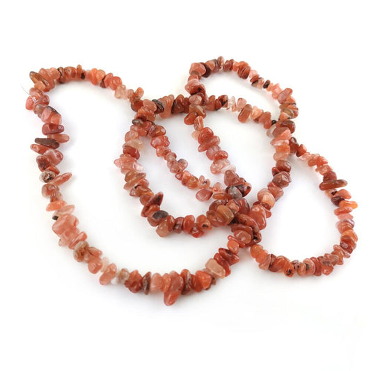 A strand of 200+ carnelian beads, orange and white in colour, 5-8mm in size, chip shaped