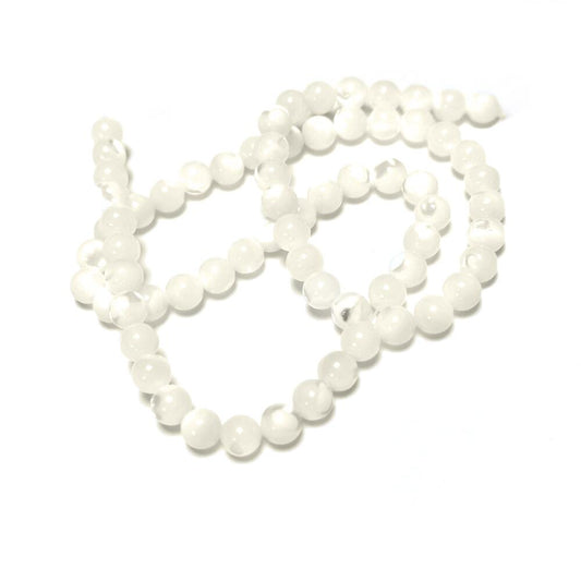 A strand of 60+ mother of pearl beads, white in colour, 6mm in size, round shaped